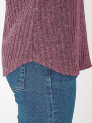 Burgundy ribbed V-neck t-shirt with a relaxed fit, shown with blue jeans.