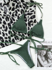 Textured dark green wrap bikini set with ring details and tie straps.