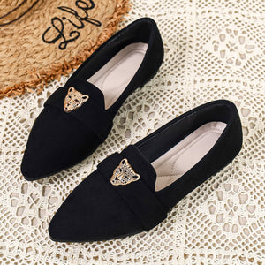 Black slip-on flats with pointed toe and gold leopard detail