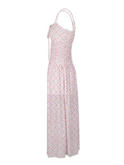 Ruched tied maxi dress in pink plaid polyester with spaghetti straps and a-line cut.
