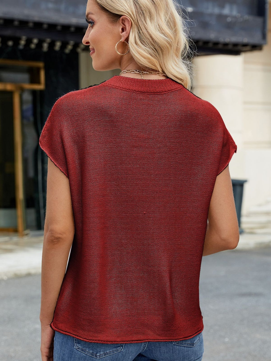 Burgundy knit cap sleeve top with vertical seams, crew neck, and casual fit.