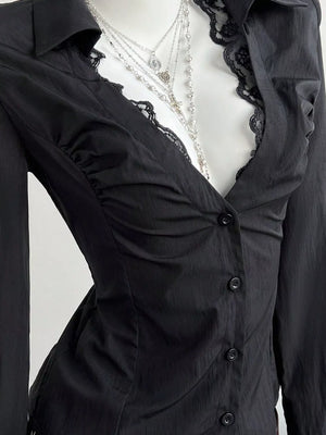Black lace-trimmed V-neck button-down shirt with ruched detailing.