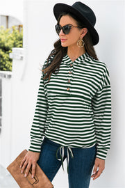 Forest green and white striped hoodie with button neck and drawstring waist.