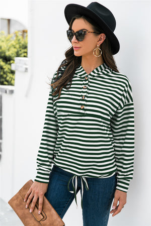 Forest green and white striped hoodie with button neck and drawstring waist.