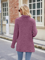 Ribbed turtleneck sweater in Fuchsia with side slits, long sleeves, and a relaxed fit.