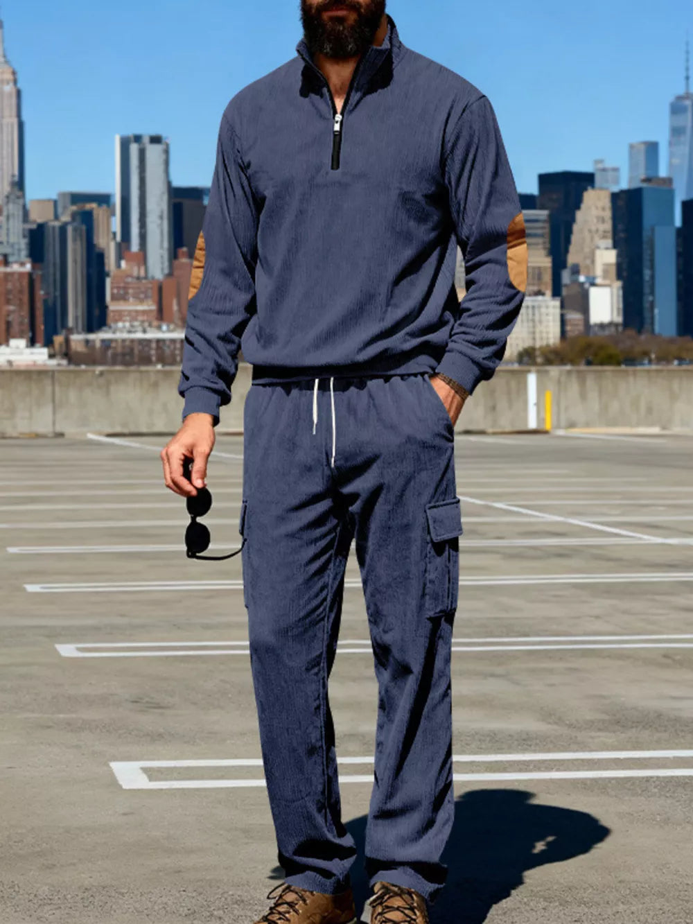 Navy blue casual two-piece set with quarter zip pullover and cargo pants.