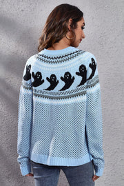 Pastel blue crewneck sweater with black ghost jacquard pattern and fair isle details.