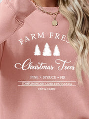 Blush pink graphic sweatshirt with "Farm Fresh Christmas Trees" text and pine trees.
