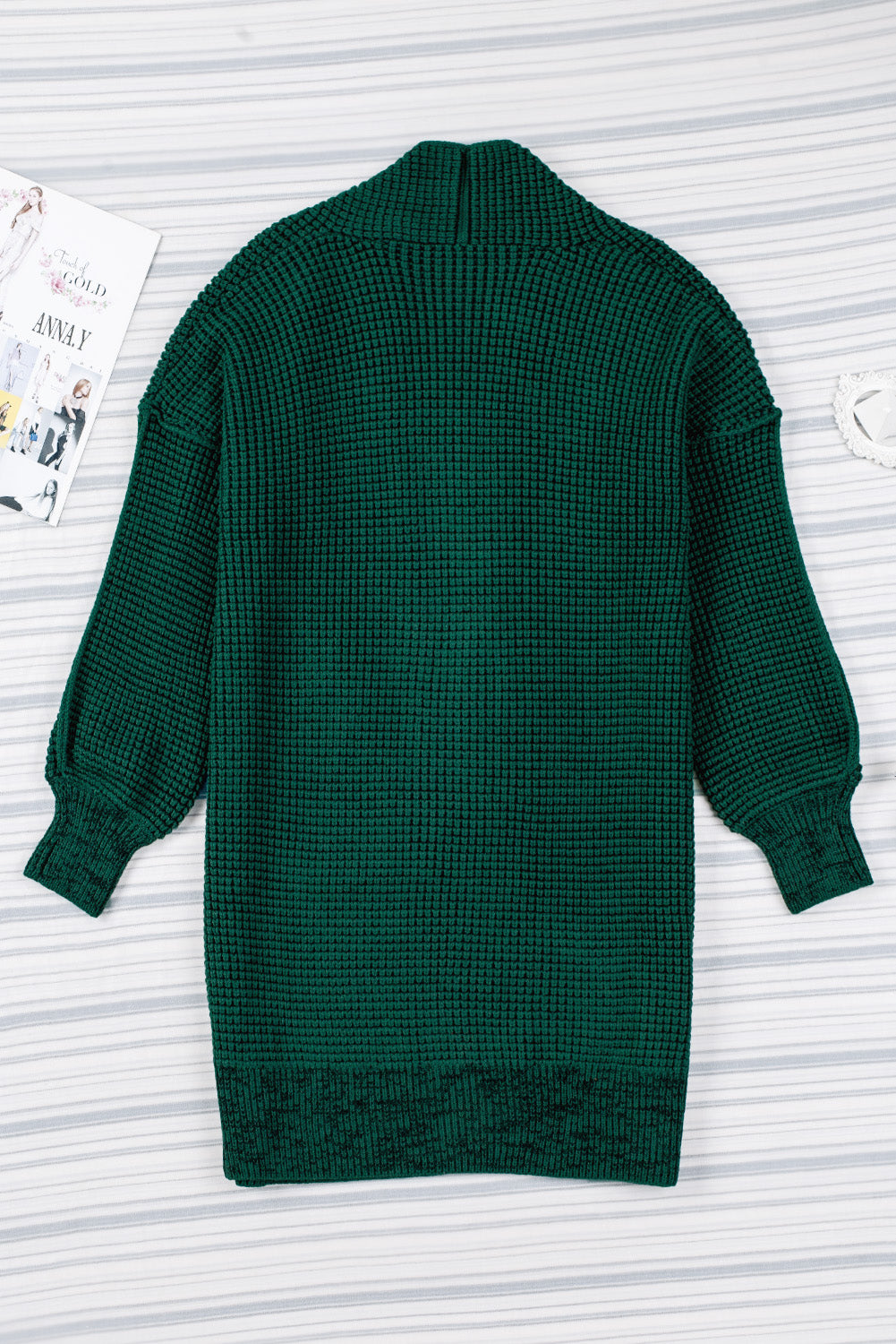 Textured puff sleeve open cardigan in Black Forest green acrylic with a waffle knit and shawl collar.
