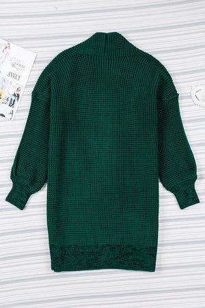 Textured puff sleeve open cardigan in Black Forest green acrylic with a waffle knit and shawl collar.