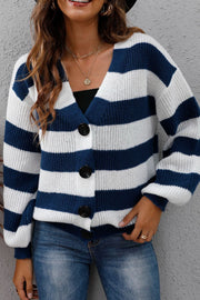Chunky stripe cardigan with balloon sleeves in navy and white acrylic, featuring a V-neck and button front.