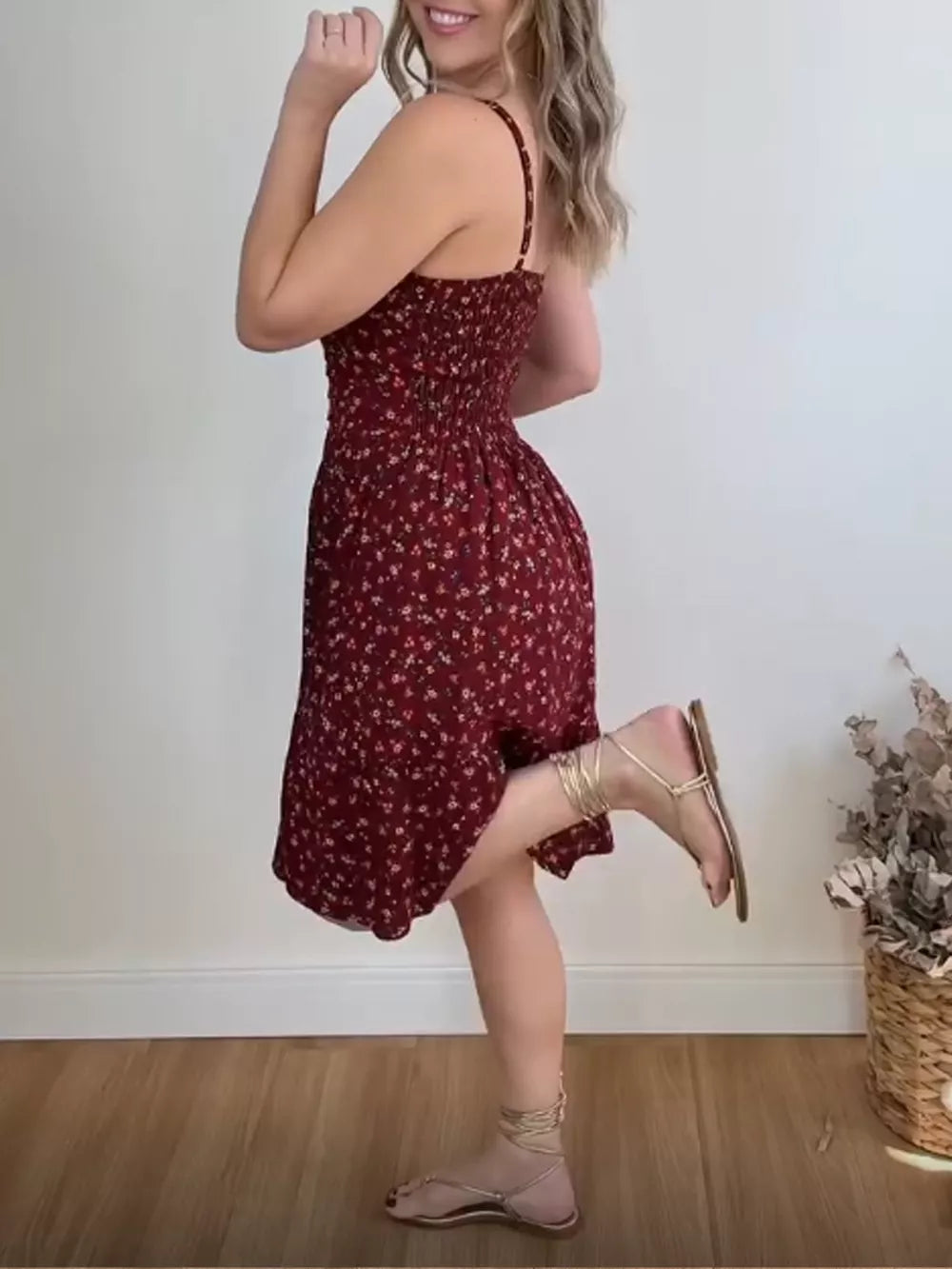 Charming floral print mini dress with smocked bodice and ruffle hem.