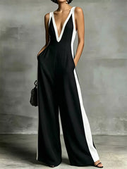 Black wide-leg jumpsuit with white contrast trim and deep V-neck