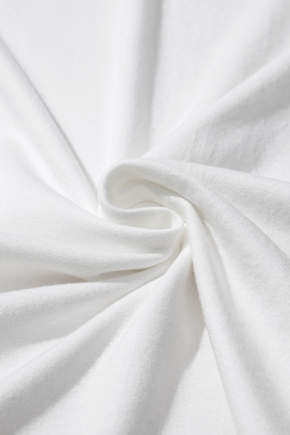 White cotton t-shirt with subtle texture and draped fabric detail.
