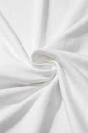 White cotton t-shirt with subtle texture and draped fabric detail.