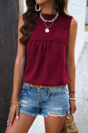 Wine textured yoke dot tank top with smocked neckline and lace trim.