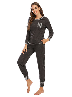 Charcoal loungewear set with striped trim on pocket and cuffs.