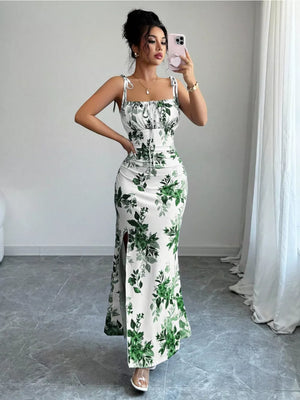 Maxi dress with floral print, tie straps, ruched bodice, and thigh-high slit.