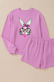 Ribbed lounge set in fuchsia pink with a graphic bunny wearing glasses and blowing bubblegum.