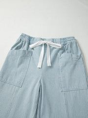 Light blue striped cotton blend jeans with drawstring waist and patch pockets.