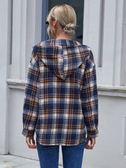 Plaid hooded shacket in navy with relaxed fit and buttoned cuffs.