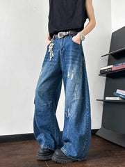 Distressed dark blue wide-leg jeans with ankle length and casual styling.