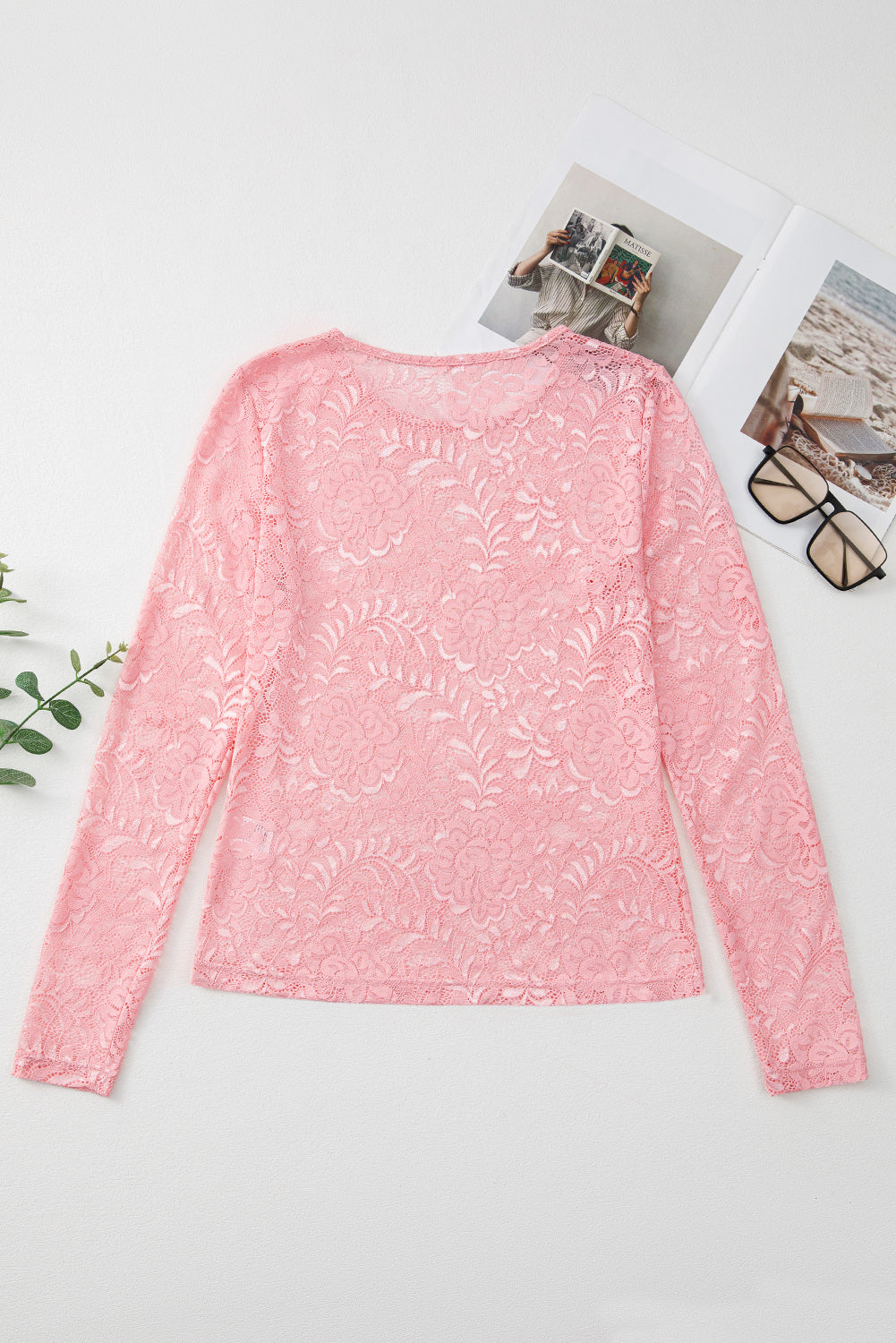 Dusty pink lace second-skin top with long sleeves and a round neckline.
