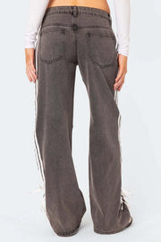 Side stripe wide-leg denim trousers in mocha with white racing stripes and tie detail.