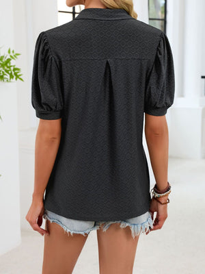 Dark green eyelet collar top with puff sleeves and back pleats.