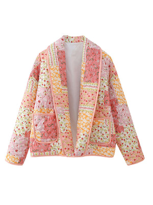 Floral quilted patchwork jacket in pink and orange with shawl collar and pockets.