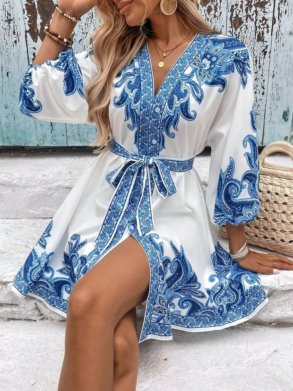 Blue paisley print mini dress with waist tie and billowy sleeves