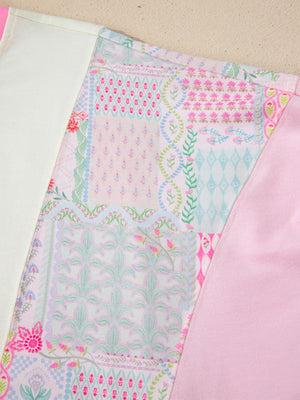 Maternity t-shirt with patchwork floral print, crew neck, and pink accent panels.