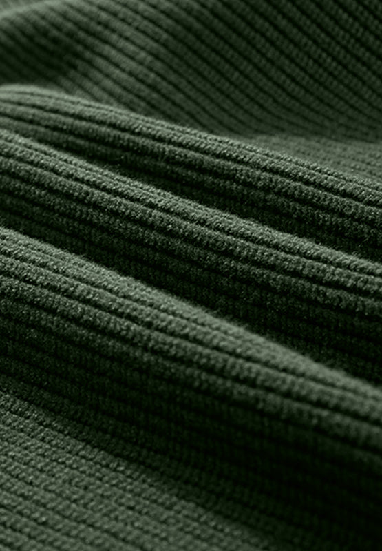 Dark green ribbed knit sweater fabric detail