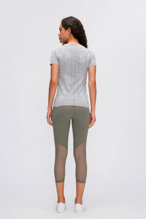 Gray activewear tee with seamless texture detail and short sleeves.