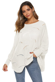 White openwork cocoon sleeve knit sweater with boat neck and relaxed fit.