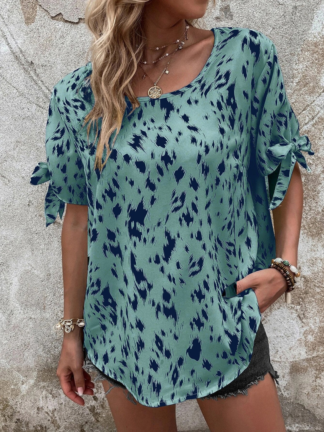 Sky blue blouse with dalmatian print and bow sleeves