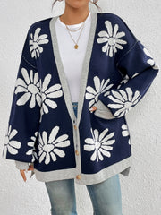 Floral jacquard knit cardigan in dark navy with white daisies and grey trim.