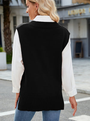 Black ribbed knit V-neck sweater vest with a relaxed fit, styled over a white collared shirt.
