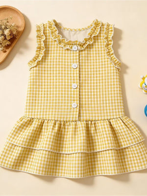 Yellow gingham baby dress with ruffled neckline and tiered skirt.