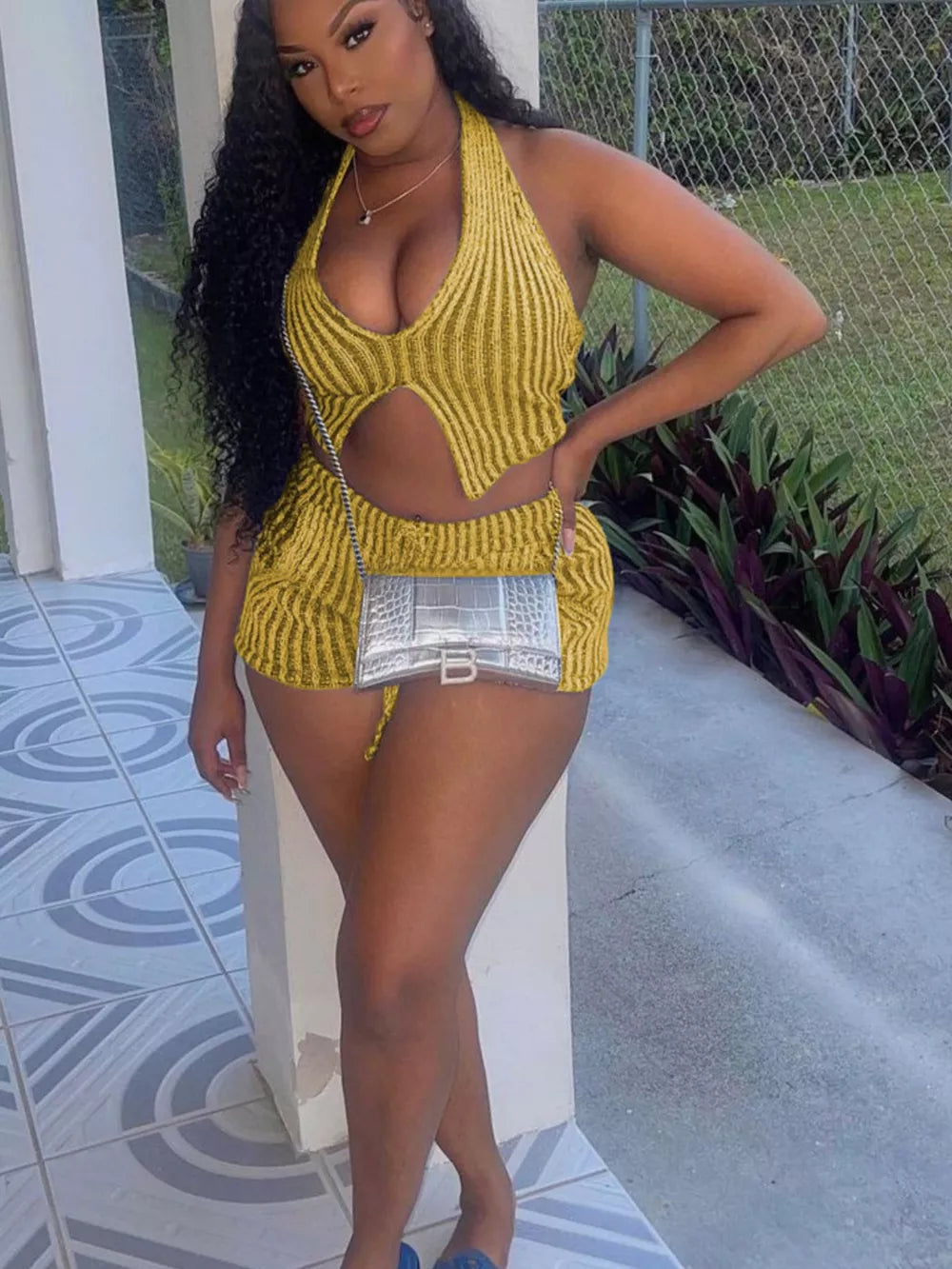 Yellow knit halter top with cut-out detail and matching shorts.