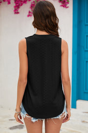 Black perforated V-neck sleeveless blouse with a textured pattern.