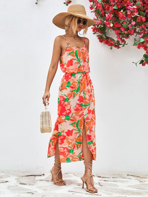 Floral print midi dress with spaghetti straps, button front, and high slits in orange and red-violet.