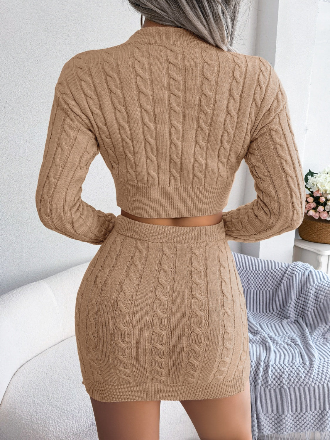 Khaki cable knit crop co-ord set with a mini skirt and long sleeve sweater.