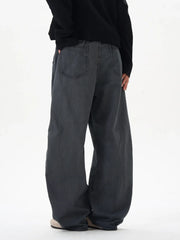 Men's oversized grey cargo pants with a relaxed fit and back pockets.