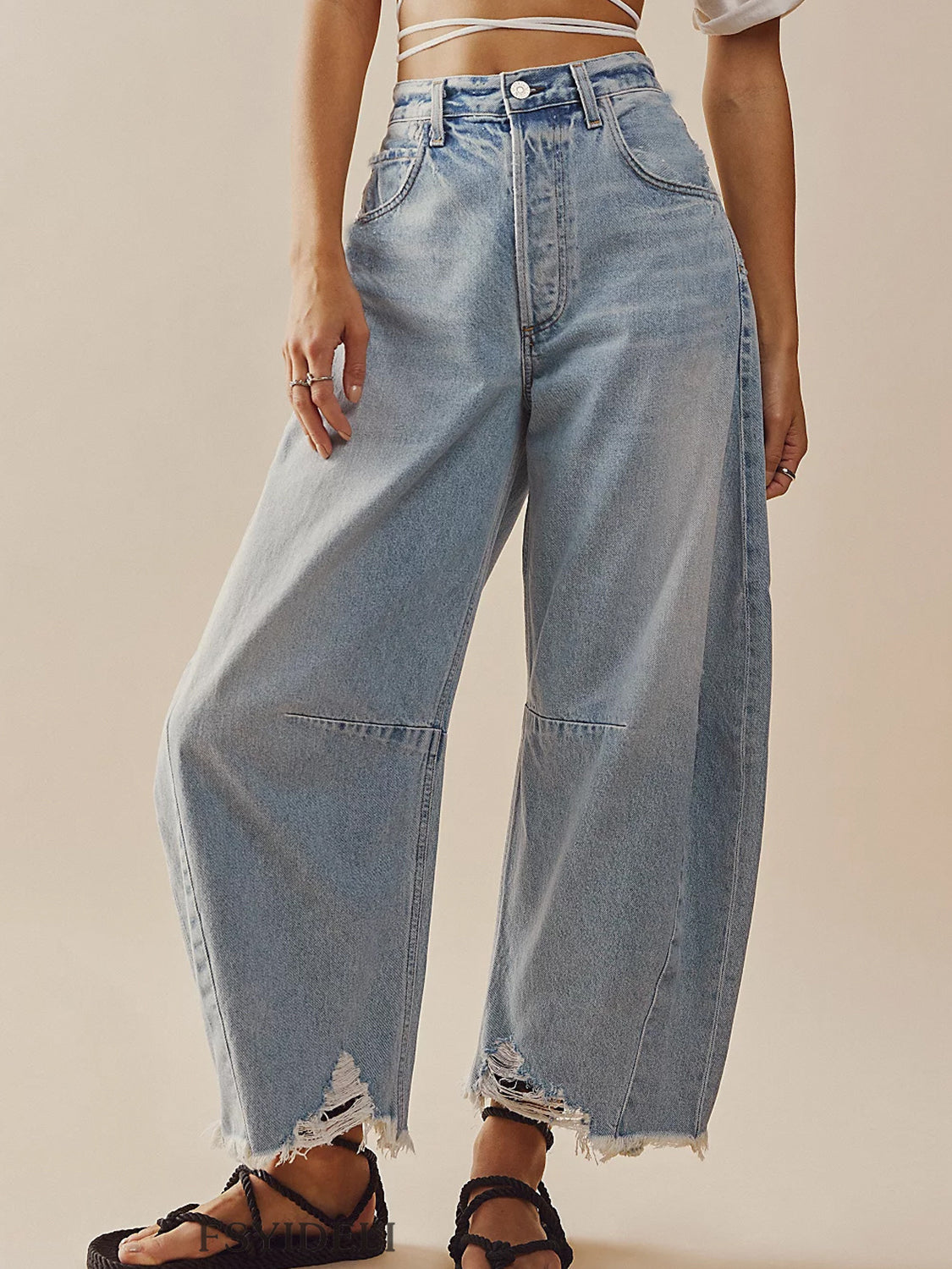 Light wash palazzo jeans with frayed hem and distressed details.