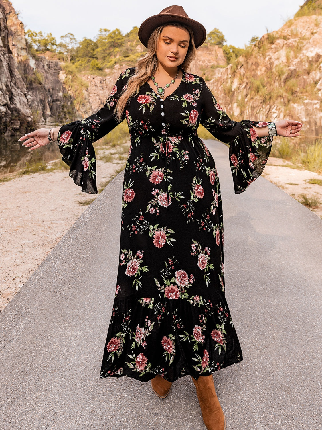 Black floral print viscose maxi dress with bell sleeves and ruffled hem