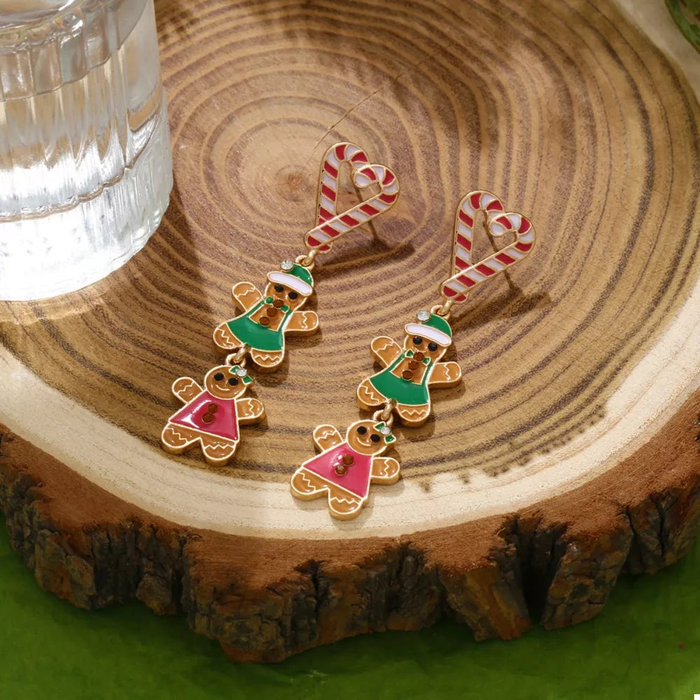 Festive dangle earrings with gingerbread men and candy cane hearts.