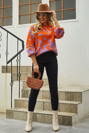 Colorblock leopard knit sweater with balloon sleeves in orange-red and purple, acrylic.