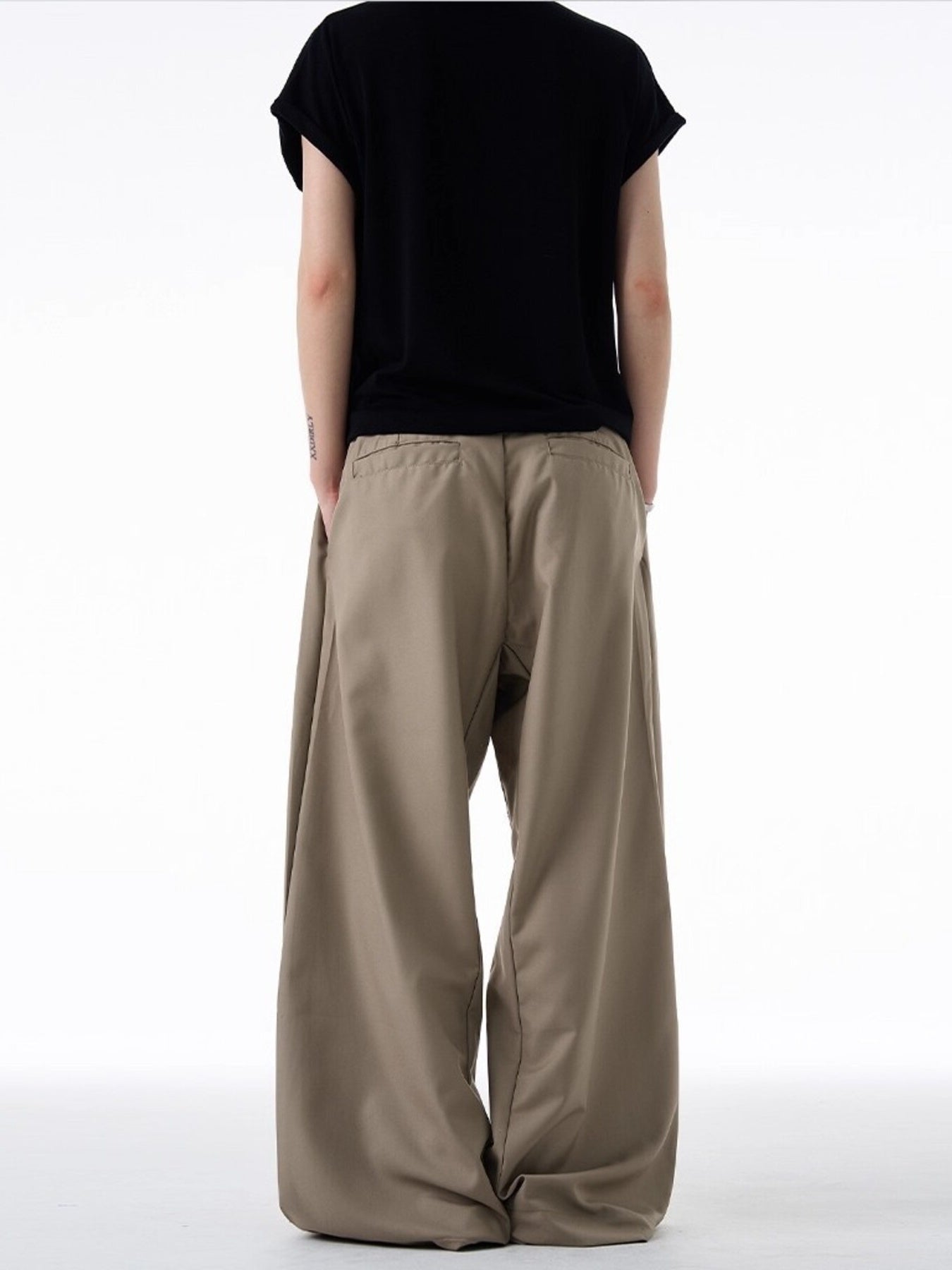 Men's khaki relaxed fit sweatpants with elastic waistband shown from back