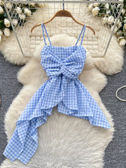 Blue gingham cami top with twisted knot detail and asymmetrical hem.
